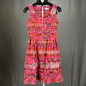 Red Calvin Klein dress with a snakeskin pattern. The dress is a size 8.